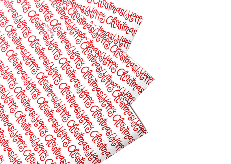Gift Wrapping Paper Says Happy Christmas in Red Writing