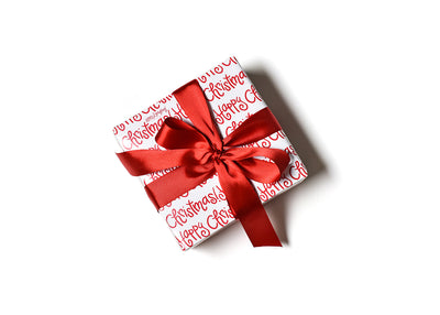 Gift Beautifully Wrapped with Happy Christmas Wrapping Paper and a Red Bow