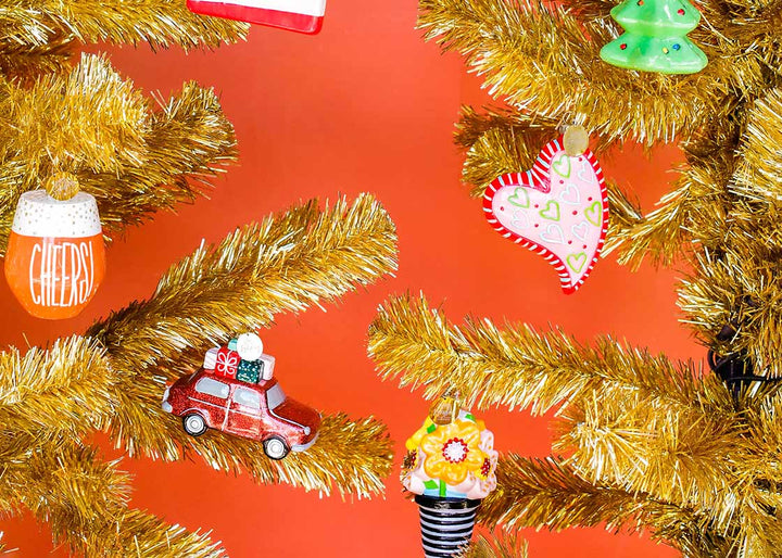 Shpaed Ornament Designs Including Heart Shaped Ornament on Gold Tinsel Tree